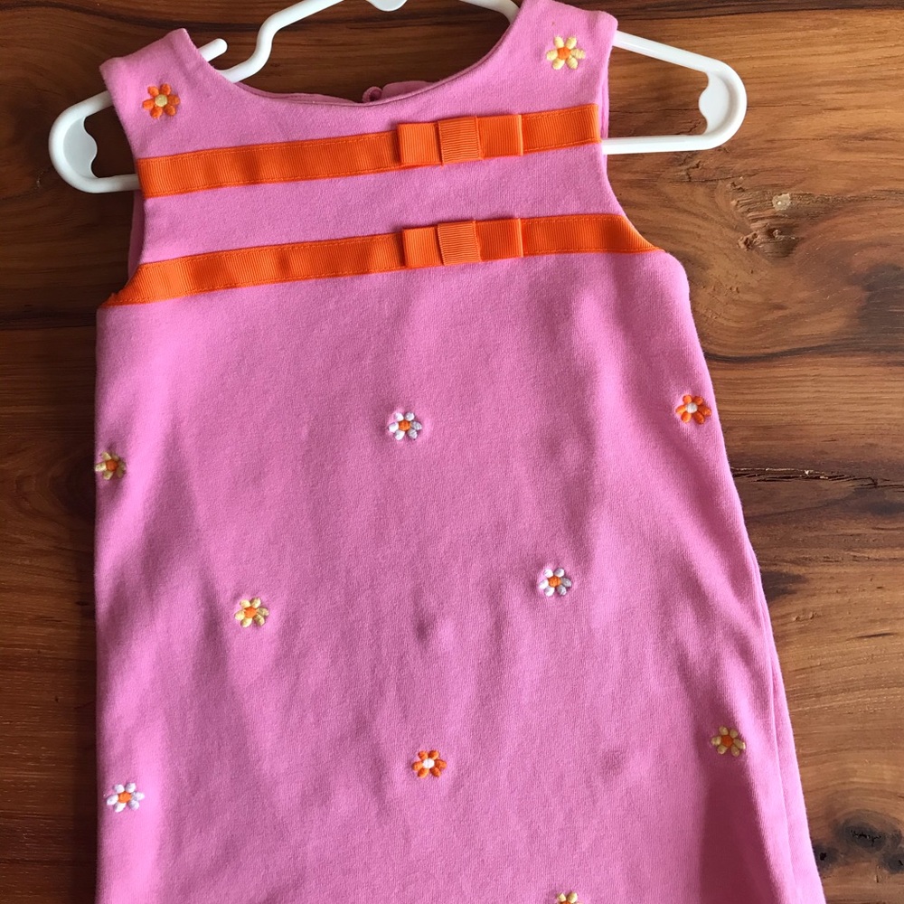 Pink sleeveless dress with flowers and orange trim